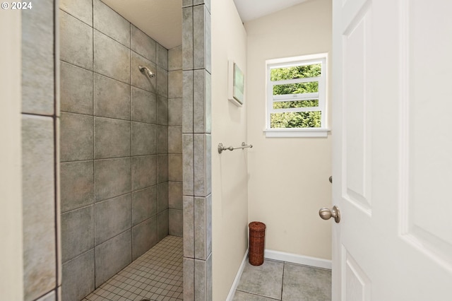 bathroom featuring a tile shower and tile patterned floors