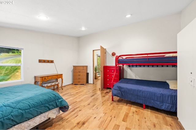 bedroom with hardwood / wood-style floors