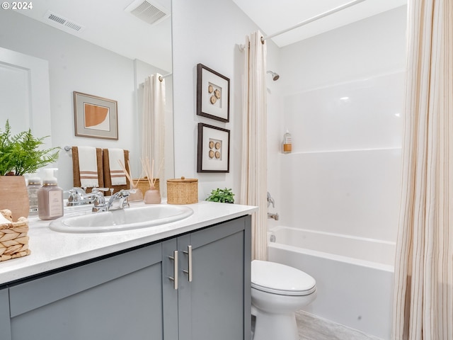 bathroom with shower / bath combination with curtain, visible vents, vanity, and toilet