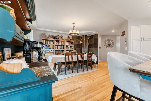 dining space featuring an inviting chandelier and hardwood / wood-style floors