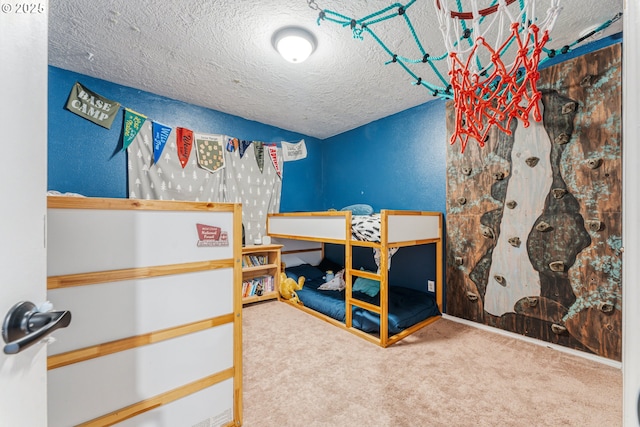 bedroom with carpet and a textured ceiling