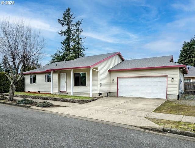 ranch-style home featuring an attached garage, crawl space, and driveway