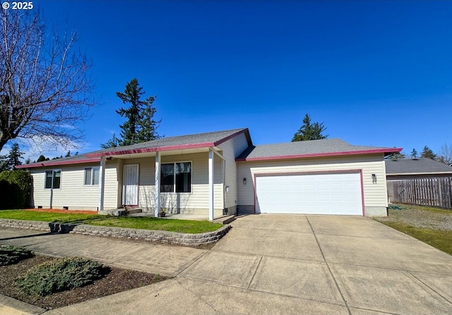 ranch-style home featuring a garage, concrete driveway, and fence