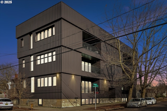 view of outdoor building at dusk