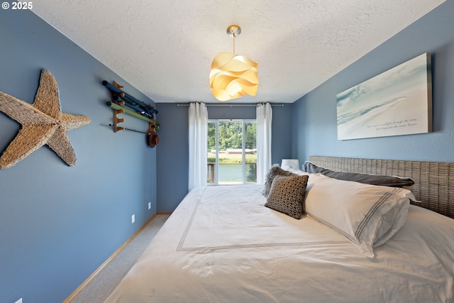 33645 Resort Dr, Pacific City, OR 97135 - bedroom featuring a textured ceiling and carpet flooring