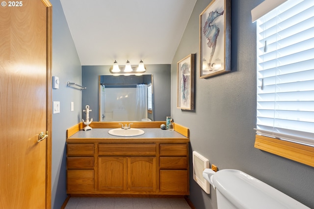 33645 Resort Dr, Pacific City, OR 97135 - full bath with vaulted ceiling, vanity, curtained shower, and heating unit