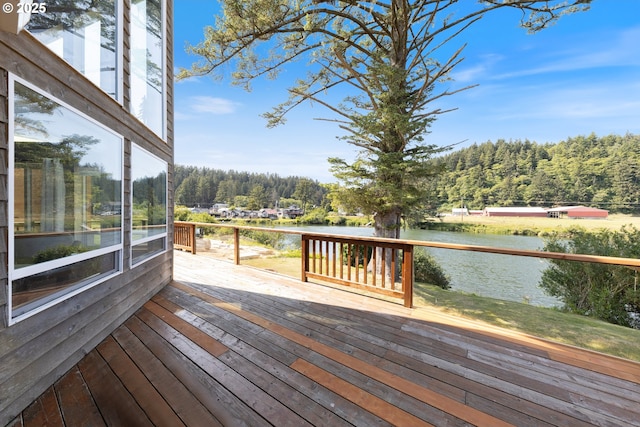 33645 Resort Dr, Pacific City, OR 97135 - wooden deck with a water view and a wooded view