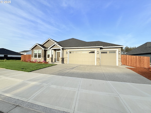8015 NE 172nd Ave, Vancouver, WA 98682 - view of front facade with stone siding, a garage, and concrete driveway
