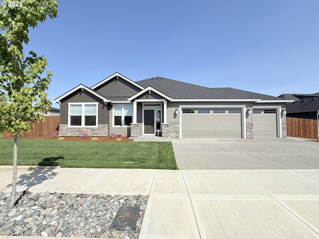 8015 NE 172nd Ave, Vancouver, WA 98682 - view of front facade featuring stone siding, a garage, and driveway