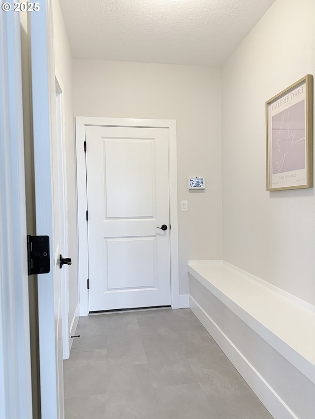 8015 NE 172nd Ave, Vancouver, WA 98682 - mudroom with baseboards and a textured ceiling
