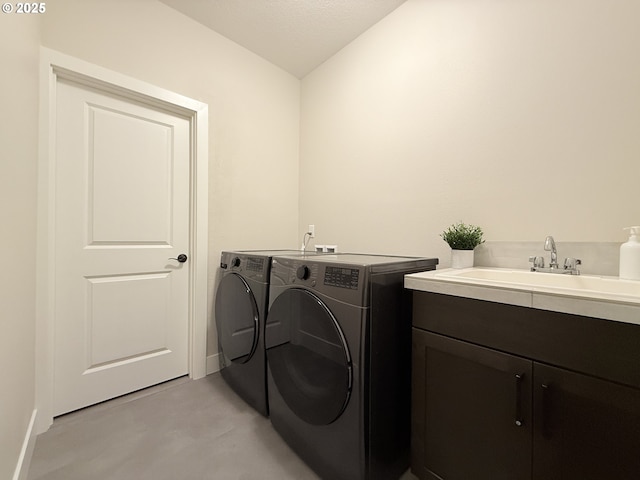 8015 NE 172nd Ave, Vancouver, WA 98682 - laundry room with washer and clothes dryer, cabinet space, and baseboards
