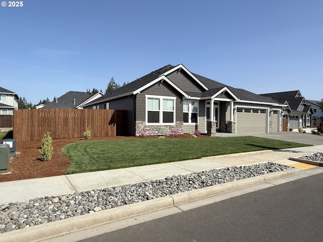 8015 NE 172nd Ave, Vancouver, WA 98682 - view of front of house with stone siding, an attached garage, and concrete driveway