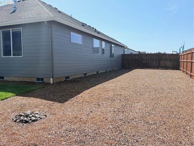 8015 NE 172nd Ave, Vancouver, WA 98682 - view of property exterior with fence and roof with shingles
