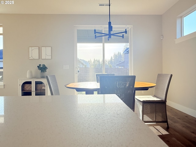 8015 NE 172nd Ave, Vancouver, WA 98682 - dining room featuring dark wood-style floors, a chandelier, and baseboards