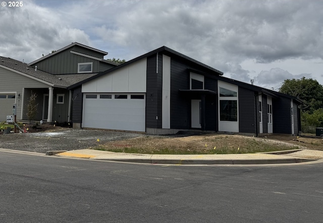 407 SE Shetterly Dr, Dallas, OR 97338 - view of front of home with an attached garage, board and batten siding, and driveway