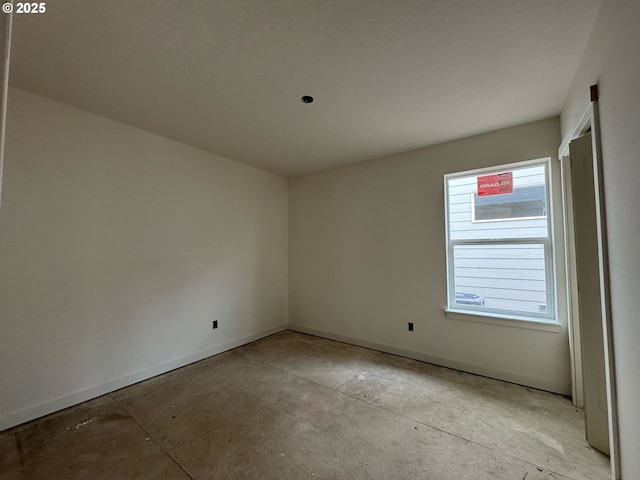 407 SE Shetterly Dr, Dallas, OR 97338 - empty room featuring concrete floors and baseboards