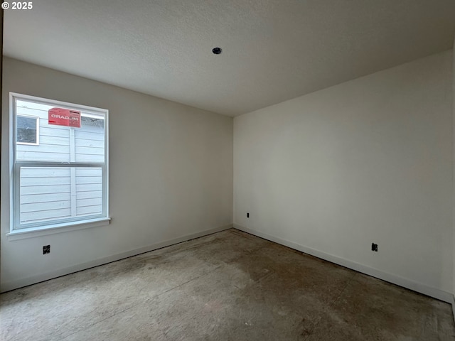 407 SE Shetterly Dr, Dallas, OR 97338 - unfurnished room featuring concrete flooring and baseboards