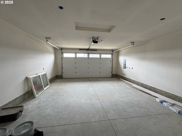 407 SE Shetterly Dr, Dallas, OR 97338 - garage featuring a garage door opener and electric panel