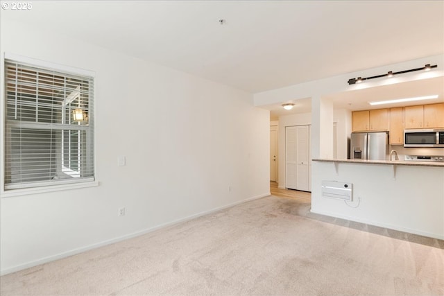 10800 SE 17th Cir Unit Q178, Vancouver, WA 98664 - unfurnished living room with light colored carpet and baseboards