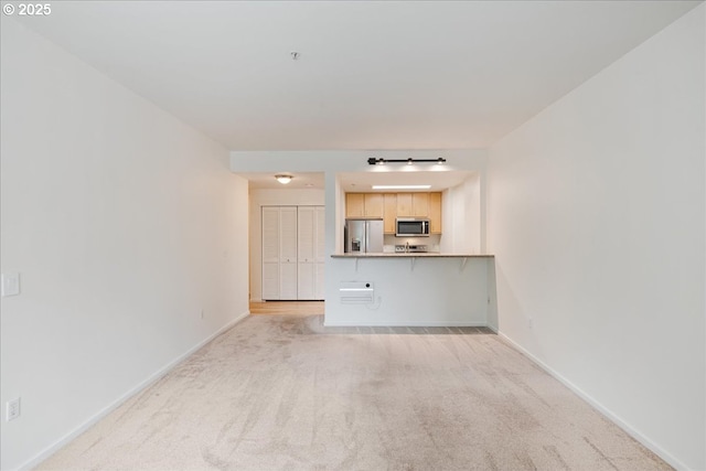 10800 SE 17th Cir Unit Q178, Vancouver, WA 98664 - unfurnished living room with light colored carpet and baseboards