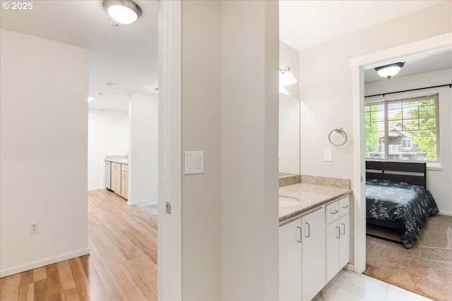 10800 SE 17th Cir Unit Q178, Vancouver, WA 98664 - bathroom featuring vanity, wood finished floors, and baseboards