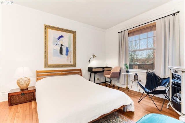 bedroom with hardwood / wood-style floors