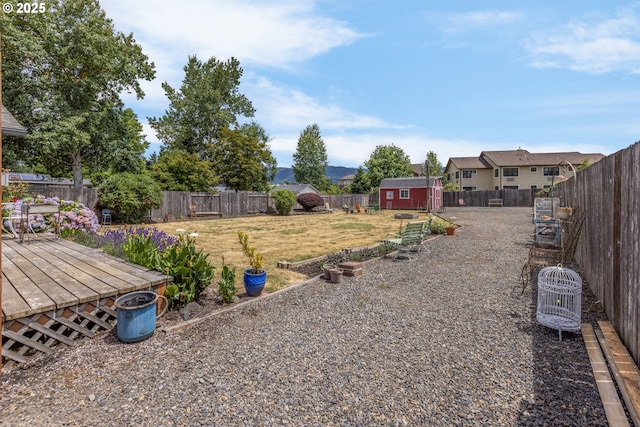 91161 N Miller St, Eugene, OR 97408 - fenced backyard with a storage unit and a wooden deck