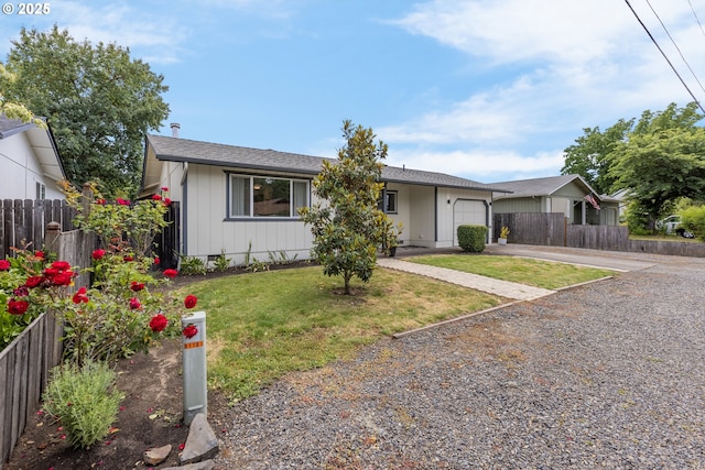 91161 N Miller St, Eugene, OR 97408 - view of front of property with gravel driveway, a garage, and board and batten siding