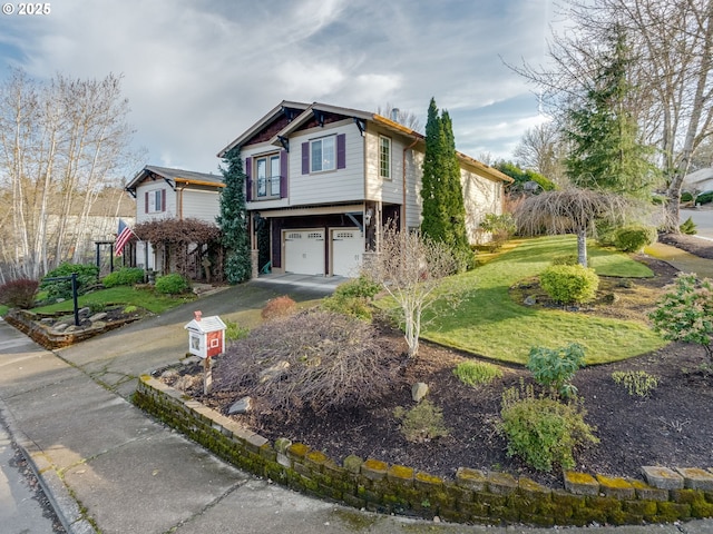 view of front of home featuring a garage, driveway, and a front lawn