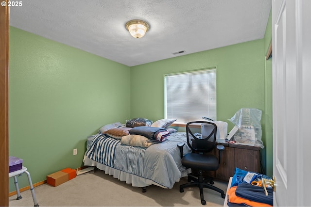 112 NE 11th St, Hermiston, OR 97838 - bedroom featuring carpet floors, a textured ceiling, and baseboards