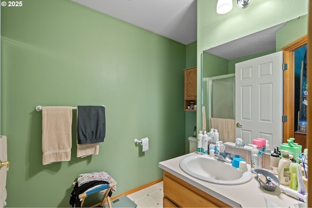 112 NE 11th St, Hermiston, OR 97838 - full bath with vanity, a stall shower, and baseboards