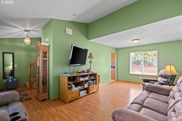 112 NE 11th St, Hermiston, OR 97838 - living room with light wood-style flooring, baseboards, and stairway