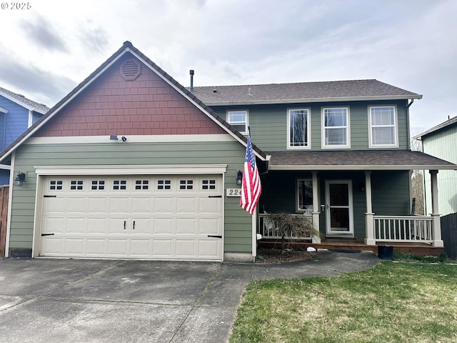 traditional-style home with a porch, an attached garage, driveway, and a shingled roof