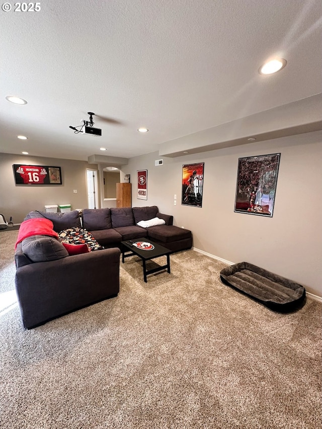 living room featuring recessed lighting, a textured ceiling, and carpet floors