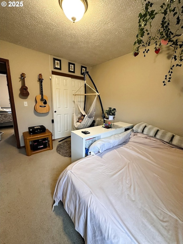 carpeted bedroom with a textured ceiling