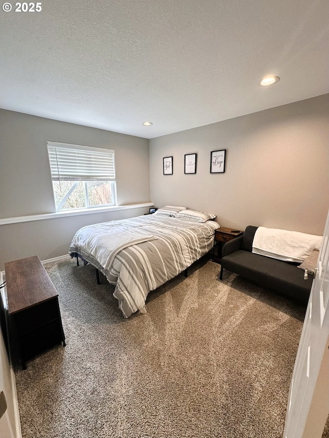 carpeted bedroom featuring recessed lighting, baseboards, and a textured ceiling