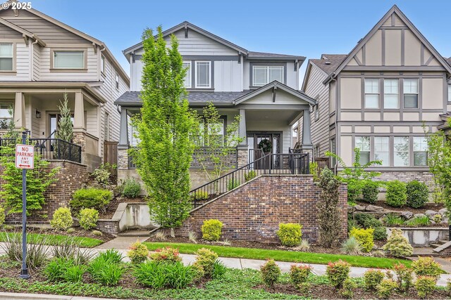 12967 SW River Terrace Blvd, Beaverton, OR 97007 - view of front facade featuring board and batten siding, stairway, and covered porch