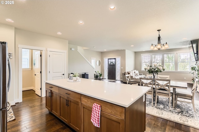 12967 SW River Terrace Blvd, Beaverton, OR 97007 - kitchen featuring freestanding refrigerator, recessed lighting, light countertops, dark wood-style flooring, and a chandelier