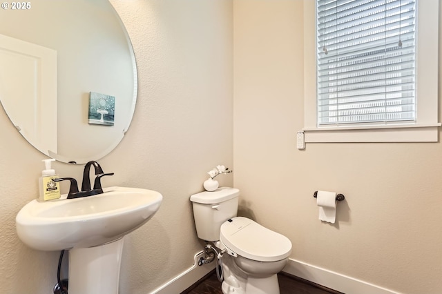 12967 SW River Terrace Blvd, Beaverton, OR 97007 - half bath with baseboards, toilet, and wood finished floors