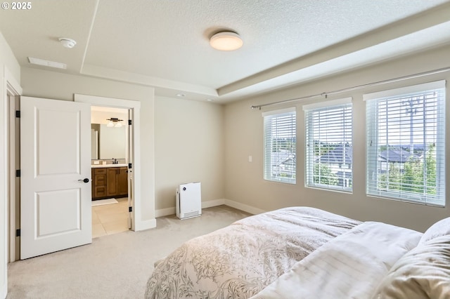 12967 SW River Terrace Blvd, Beaverton, OR 97007 - bedroom featuring multiple windows, light carpet, a raised ceiling, and a sink