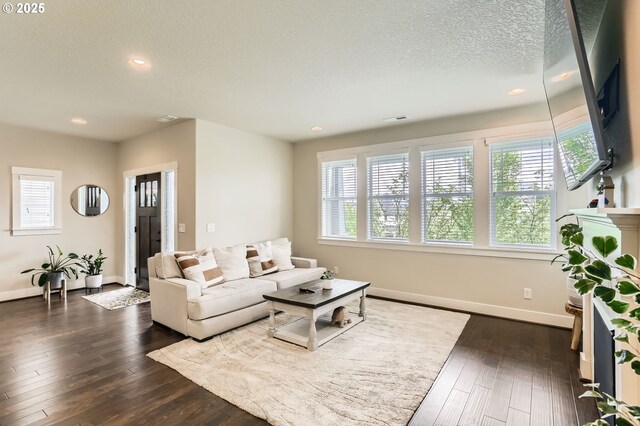 12967 SW River Terrace Blvd, Beaverton, OR 97007 - living area featuring plenty of natural light, a textured ceiling, recessed lighting, and dark wood-type flooring