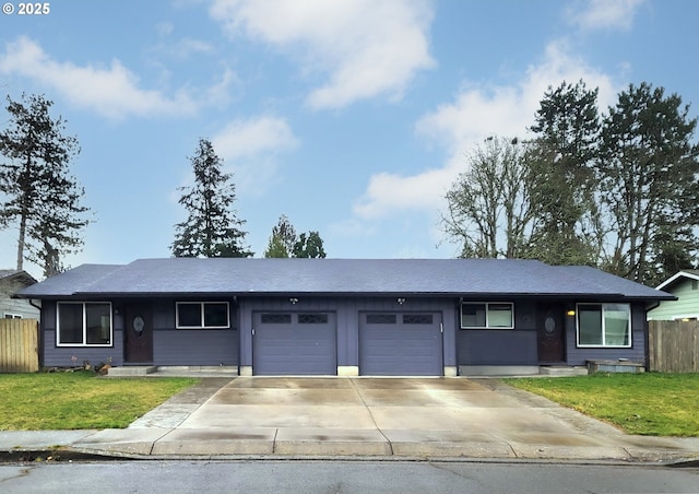 single story home featuring a garage, driveway, a front lawn, and fence