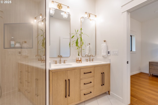 bathroom featuring hardwood / wood-style flooring, vanity, and an enclosed shower