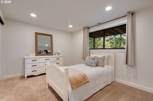 bedroom featuring light colored carpet