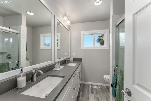 185 W Oriole Dr, Roseburg, OR 97471 - bathroom with toilet, a sink, a shower stall, and baseboards