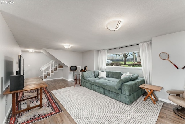 185 W Oriole Dr, Roseburg, OR 97471 - living room featuring baseboards, stairway, and wood finished floors