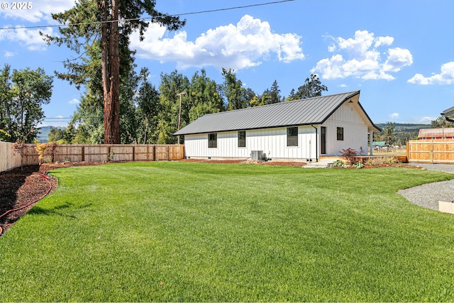 31395 Kenady Ln, Cottage Grove, OR 97424 - back of property with board and batten siding, metal roof, and central air condition unit