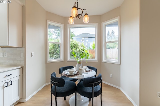10134 SE 54th Ct, Milwaukie, OR 97222 - dining space with plenty of natural light, light wood-style floors, and baseboards