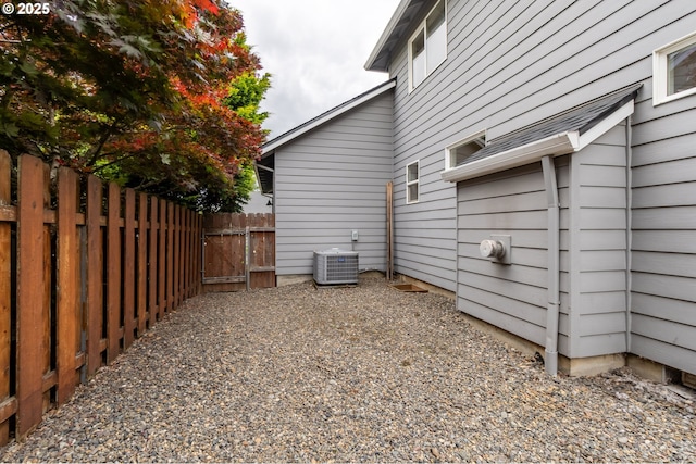 10134 SE 54th Ct, Milwaukie, OR 97222 - view of side of property featuring central AC unit and a gate