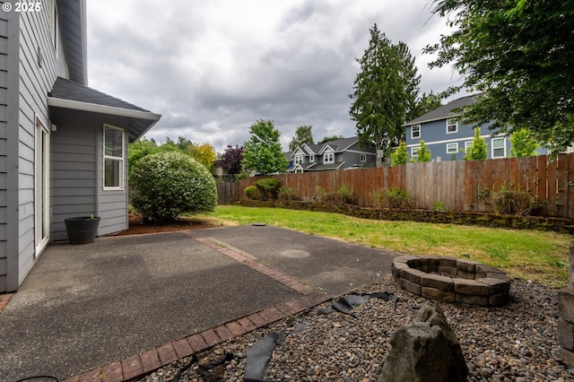 10134 SE 54th Ct, Milwaukie, OR 97222 - view of patio with a fire pit and a residential view
